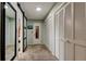 Spacious hallway with mirrored closet doors and built-in storage at 390 Cypress Creek Cir, Oldsmar, FL 34677