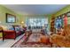 Bright living room with hardwood floors and sliding doors at 390 Cypress Creek Cir, Oldsmar, FL 34677