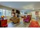 Relaxing living room featuring leather furniture, fireplace and wood floors at 390 Cypress Creek Cir, Oldsmar, FL 34677