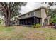 Screened patio with hot tub and seating area at 390 Cypress Creek Cir, Oldsmar, FL 34677