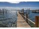 Wooden dock extending over sparkling water at 620 Boca Ciega Isle Dr, St Pete Beach, FL 33706