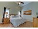 Bright bedroom with king-size bed, wood furniture, and large window at 8622 Thimbleberry Ln, Tampa, FL 33635