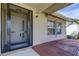 Inviting house exterior featuring a screened entryway, and a tiled patio at 8622 Thimbleberry Ln, Tampa, FL 33635