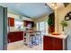 Well-equipped kitchen with granite countertops, wooden cabinets, and an island at 8622 Thimbleberry Ln, Tampa, FL 33635