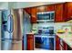 Stainless steel appliances and wood cabinets in this kitchen at 8622 Thimbleberry Ln, Tampa, FL 33635