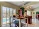 Kitchen island with view of pool and sliding doors at 8622 Thimbleberry Ln, Tampa, FL 33635