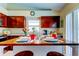 Kitchen island with seating for two, perfect for casual dining at 8622 Thimbleberry Ln, Tampa, FL 33635