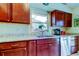 Kitchen features granite countertops and wood cabinets at 8622 Thimbleberry Ln, Tampa, FL 33635