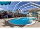 Inviting kidney-shaped swimming pool with screened enclosure at 8622 Thimbleberry Ln, Tampa, FL 33635