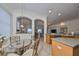 Bright kitchen and breakfast nook with clear view to the outside, dining table, and modern appliances at 1120 Emerald Dunes Dr, Sun City Center, FL 33573