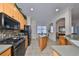 Well-lit kitchen showcases modern appliances, a center island, and seamless transition to the dining area at 1120 Emerald Dunes Dr, Sun City Center, FL 33573