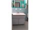 Bathroom with light blue tile and a single vanity at 2462 Brazilia Dr # 20, Clearwater, FL 33763