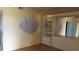 Bedroom with built-in mirrored dresser and art at 2462 Brazilia Dr # 20, Clearwater, FL 33763