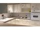 Efficient kitchen, white cabinets and appliances at 2462 Brazilia Dr # 20, Clearwater, FL 33763