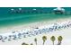 Aerial view of beach with pier and umbrellas at 660 Island Way # 908, Clearwater Beach, FL 33767