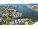 Aerial view of condo complex with tennis courts and marina at 660 Island Way # 908, Clearwater Beach, FL 33767