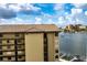 Building exterior and partial waterfront view at 660 Island Way # 908, Clearwater Beach, FL 33767