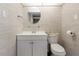 Clean bathroom with white vanity, toilet and oval mirror at 660 Island Way # 908, Clearwater Beach, FL 33767