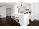 Modern kitchen with breakfast bar and white cabinetry at 660 Island Way # 908, Clearwater Beach, FL 33767