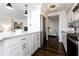 Open concept kitchen with white cabinets, quartz counters & breakfast bar at 660 Island Way # 908, Clearwater Beach, FL 33767