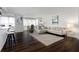 Open living area with hardwood floors and L-shaped sofa at 660 Island Way # 908, Clearwater Beach, FL 33767
