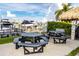 Outdoor patio area with picnic tables and water views at 660 Island Way # 908, Clearwater Beach, FL 33767