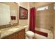 Bathroom with granite vanity and tiled shower/tub combo at 297 Martellago Dr, North Venice, FL 34275