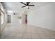 Spacious living area with two ceiling fans and plenty of natural light at 3020 Bonaventure Cir # 102, Palm Harbor, FL 34684