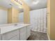 Bathroom with shower/tub combo, white vanity, and floral shower curtain at 345 Bayshore Blvd # 308, Tampa, FL 33606