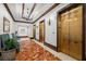 Building hallway with marble flooring, gold elevators, and chandelier at 345 Bayshore Blvd # 308, Tampa, FL 33606