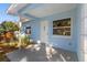 Inviting front porch with white door and light blue walls at 615 W Virginia Ave, Tampa, FL 33603