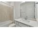 Clean bathroom with white vanity, quartz countertop and shower/tub combo at 9442 Shorebird Ct, Parrish, FL 34219