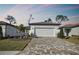 House exterior with white garage door and paver driveway at 9442 Shorebird Ct, Parrish, FL 34219