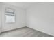 Bright bedroom featuring gray carpeting and a window with blinds at 9446 Shorebird Ct, Parrish, FL 34219