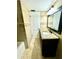 Bathroom with granite vanity and updated fixtures at 2525 W Bay Dr # A32, Belleair Bluffs, FL 33770