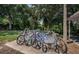 Outdoor bike rack with various bicycles at 2525 W Bay Dr # A32, Belleair Bluffs, FL 33770