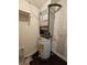 Laundry closet with water heater and HVAC unit at 2525 W Bay Dr # A32, Belleair Bluffs, FL 33770