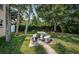 Relaxing patio area with a stone table and benches at 2525 W Bay Dr # A32, Belleair Bluffs, FL 33770