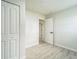 Bright bedroom with wood-look floors and spacious closet at 3414 Lindsey St, Dover, FL 33527