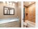 Clean bathroom with updated vanity and tiled shower/tub combo at 3607 E Bay Dr # 211, Holmes Beach, FL 34217