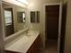 Bathroom featuring a vanity, a shower, and a large framed mirror at 5337 Treig Ln, Wesley Chapel, FL 33545