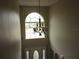 Elegant entryway with a chandelier and an arched window at 5337 Treig Ln, Wesley Chapel, FL 33545