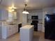 Bright kitchen featuring an island and stainless steel appliances at 5337 Treig Ln, Wesley Chapel, FL 33545