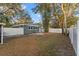 Backyard view of house with mature trees at 623 15Th Nw Ave, Largo, FL 33770