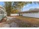 Large backyard with mature trees and fence at 623 15Th Nw Ave, Largo, FL 33770