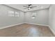 Spacious bedroom with hardwood floors and ceiling fan at 623 15Th Nw Ave, Largo, FL 33770