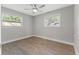 Bright bedroom with hardwood floors and two windows at 623 15Th Nw Ave, Largo, FL 33770