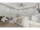 Main bedroom with large bed, sitting area, and hardwood floors at 623 15Th Nw Ave, Largo, FL 33770