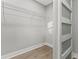 Walk-in closet with wood floors and sliding barn door at 623 15Th Nw Ave, Largo, FL 33770