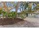 Front yard with mature trees and landscaping at 623 15Th Nw Ave, Largo, FL 33770